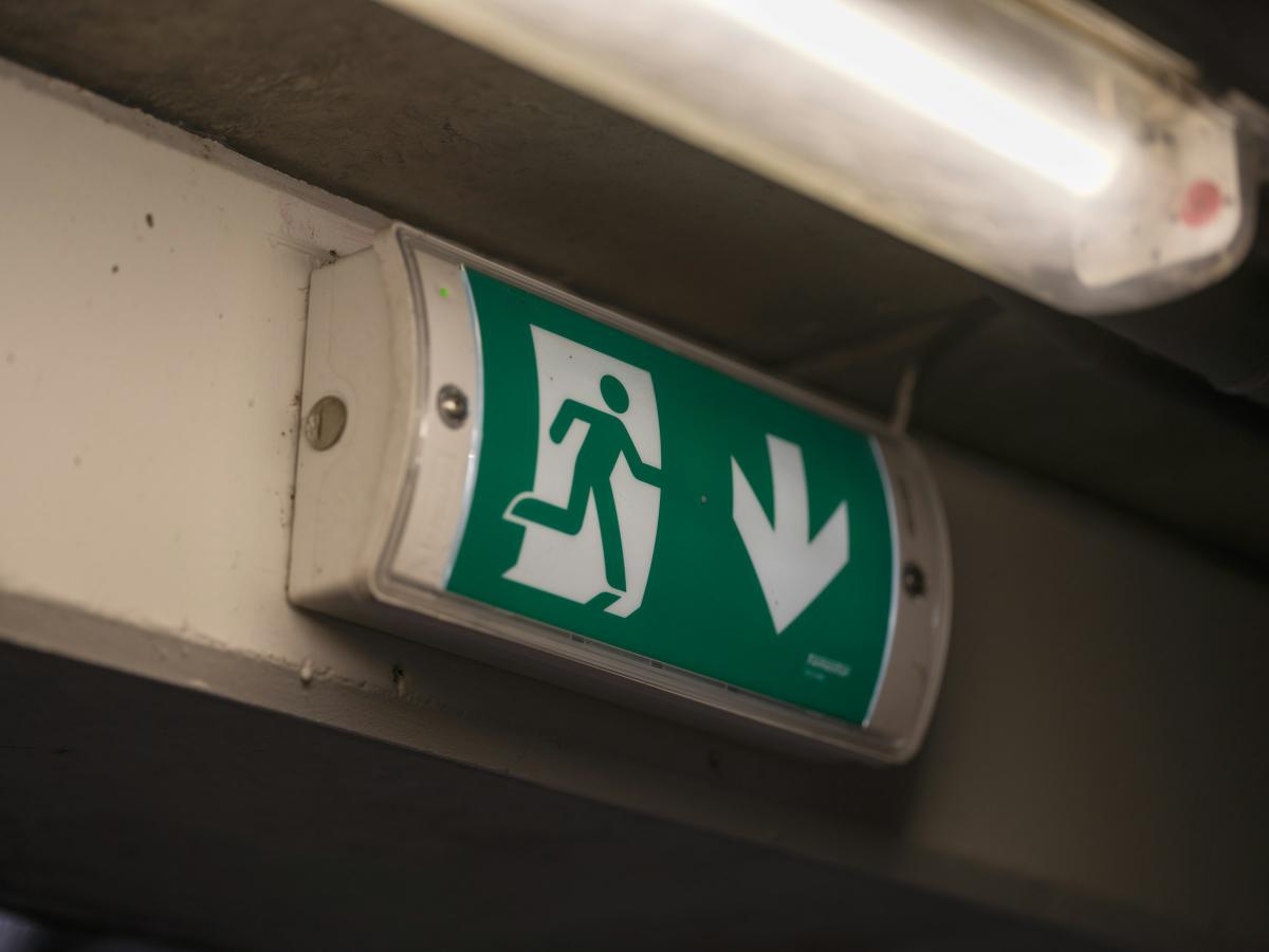 Illuminated emergency exit sign tested under BS 5266-1