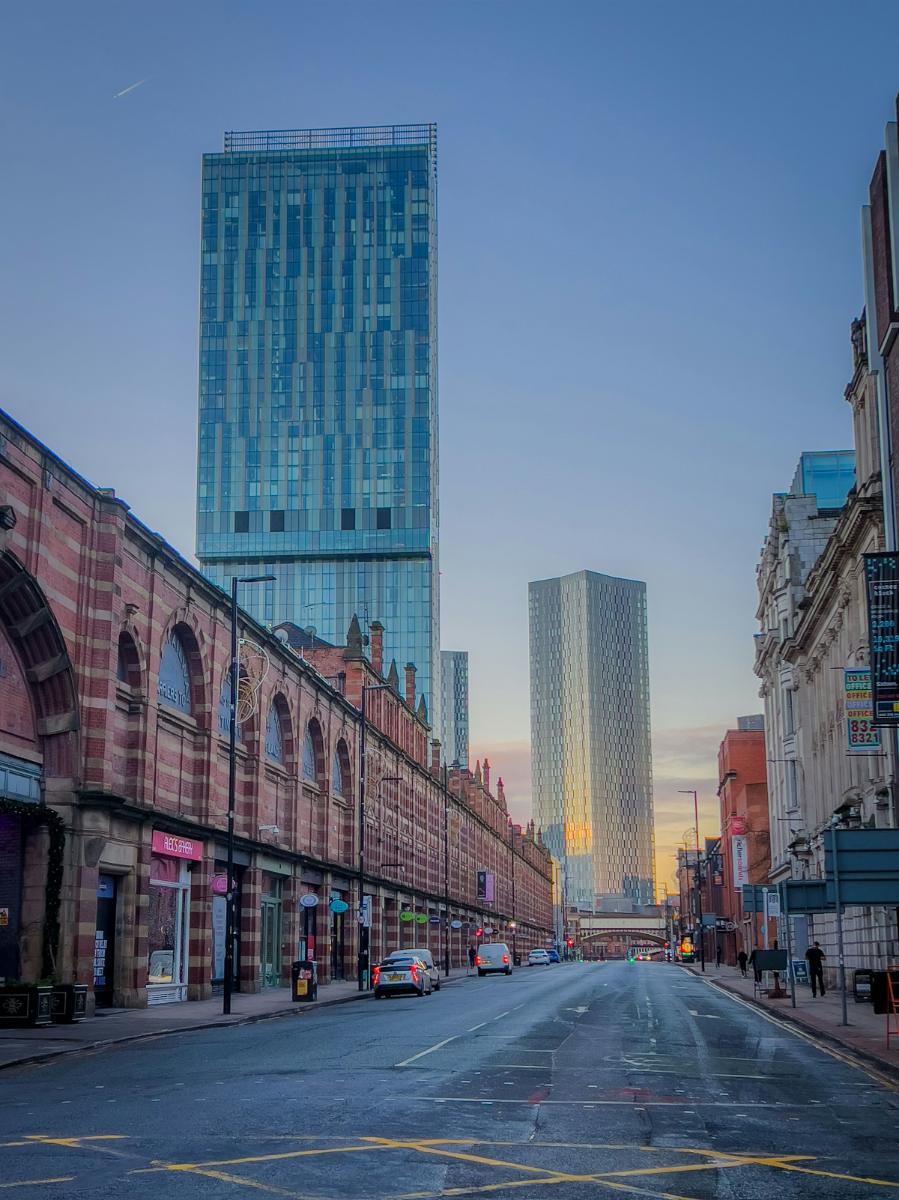 Manchester city centre street with residential towers