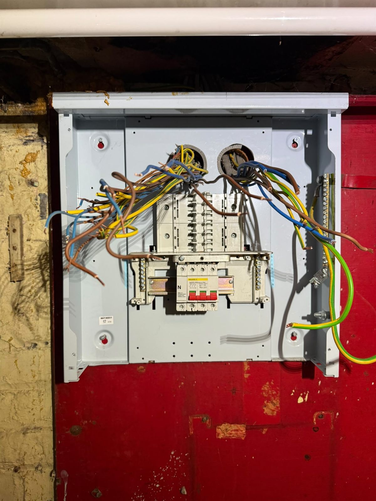 Mid installation, conductors drawn in and ready to land.